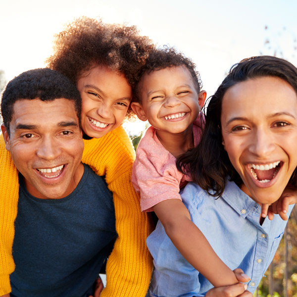 smiling family of four